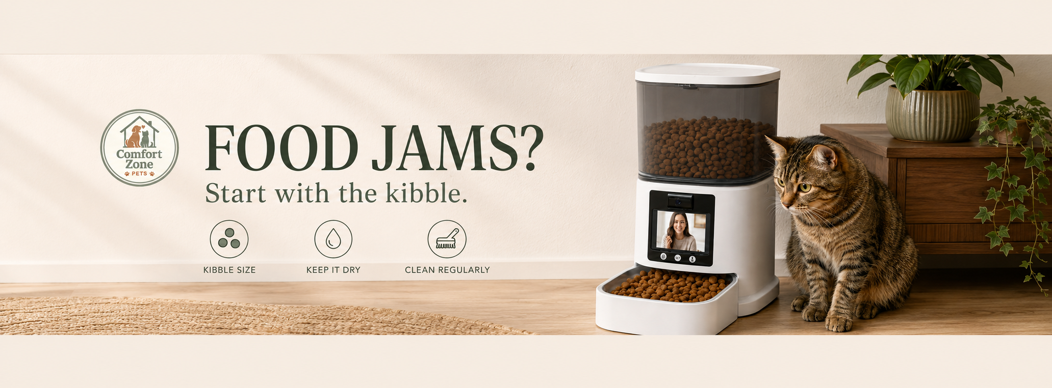 Tabby cat beside an automatic cat feeder with tips for preventing food jams through proper kibble size, dry storage, and regular cleaning.