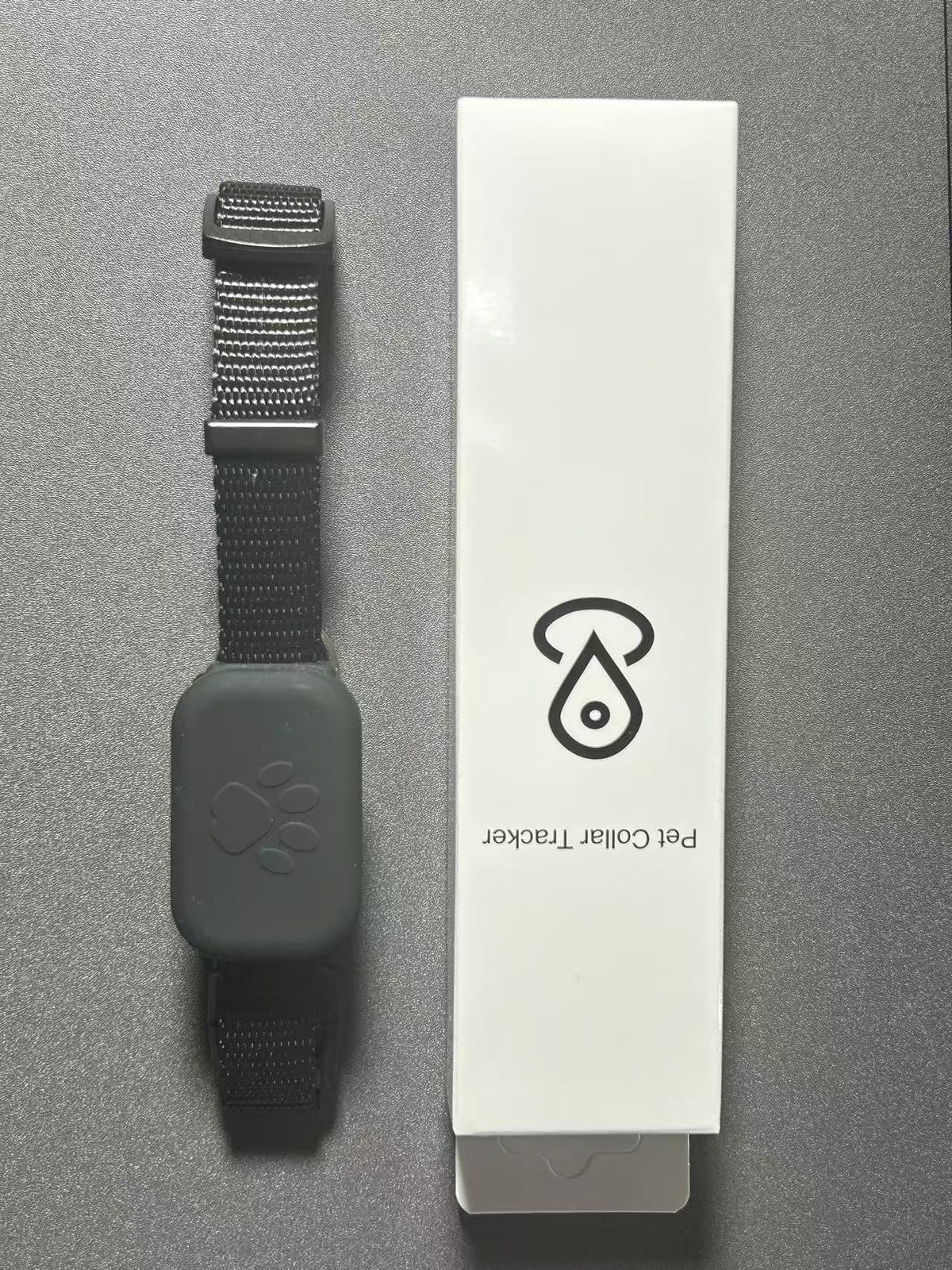 Black Find My compatible pet collar with tracker tag and retail box